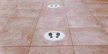 Floor tiles with social distancing markers