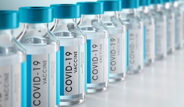 Vials of COVID-19 vaccine in a line