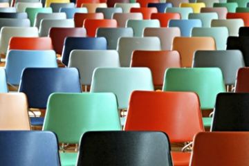 Group of different colored empty chairs