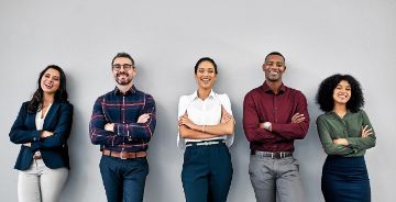 Diverse group of individuals in business attire standing in a line