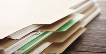 Stack of folders with documents inside