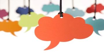 Multicolored hanging cloud speech bubbles