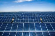 Rows of solar panels with blue sky