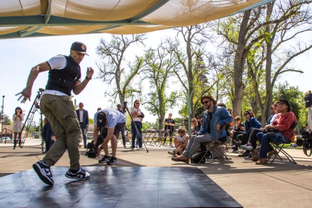 person dancing with people watching