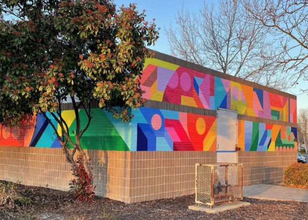 mural painted on wall with various colors and shapes