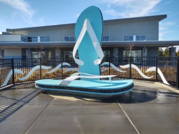 A pair of aquamarine flip flops looms surreally over the poolside. This 15ft H x 6ft W sculpture doubles as a bench for swimmers.