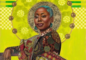 A quilted image of entrepreneur Pinky Cole created by Shonna McDaniels. Pinky Cole looks at the view with calm confidence; clothed in brightly colored elegantly draped fabric against a chartreuse background. Her right arm rests on a bench and her left arm is at her side as she turns toward the viewer. The color of her vivid blue-green, short-cut hair is mirrored in her large earrings. There is a halo of gold around her head.