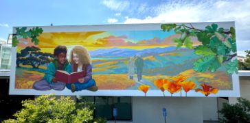Two children read a book in the foreground bordered by poppies and oakleaves, in the background, an elderly couple walks down a peth into a beautiful landscape bathed in sunset colors