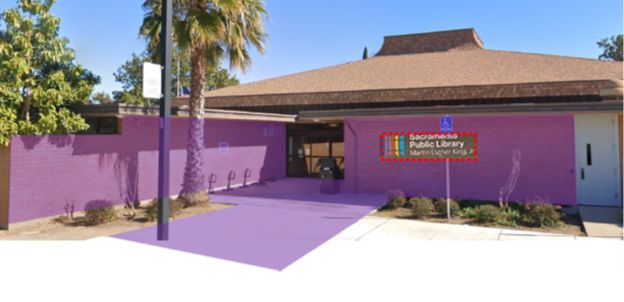 A building with the entryway highlighted in purple. The highlight extends across the front of the building to the right of the entryway and along a wall on the left of the entry. The entry pathway itsself is also highlighted.