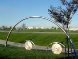 10-foot Stainless steel eyes peer over a hill