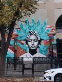  A mural depicting beautiful Mexican woman with a blue headdress