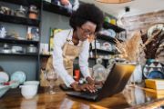 Women at computer at a coffee shop