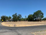 street corner with a vacant parcel of land