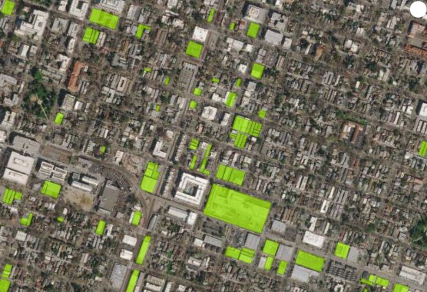 Aerial view of Sacramento with green highlights of vacant lots
