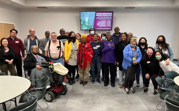 Group photo of community members and city staff at the District 8 Community Listening session