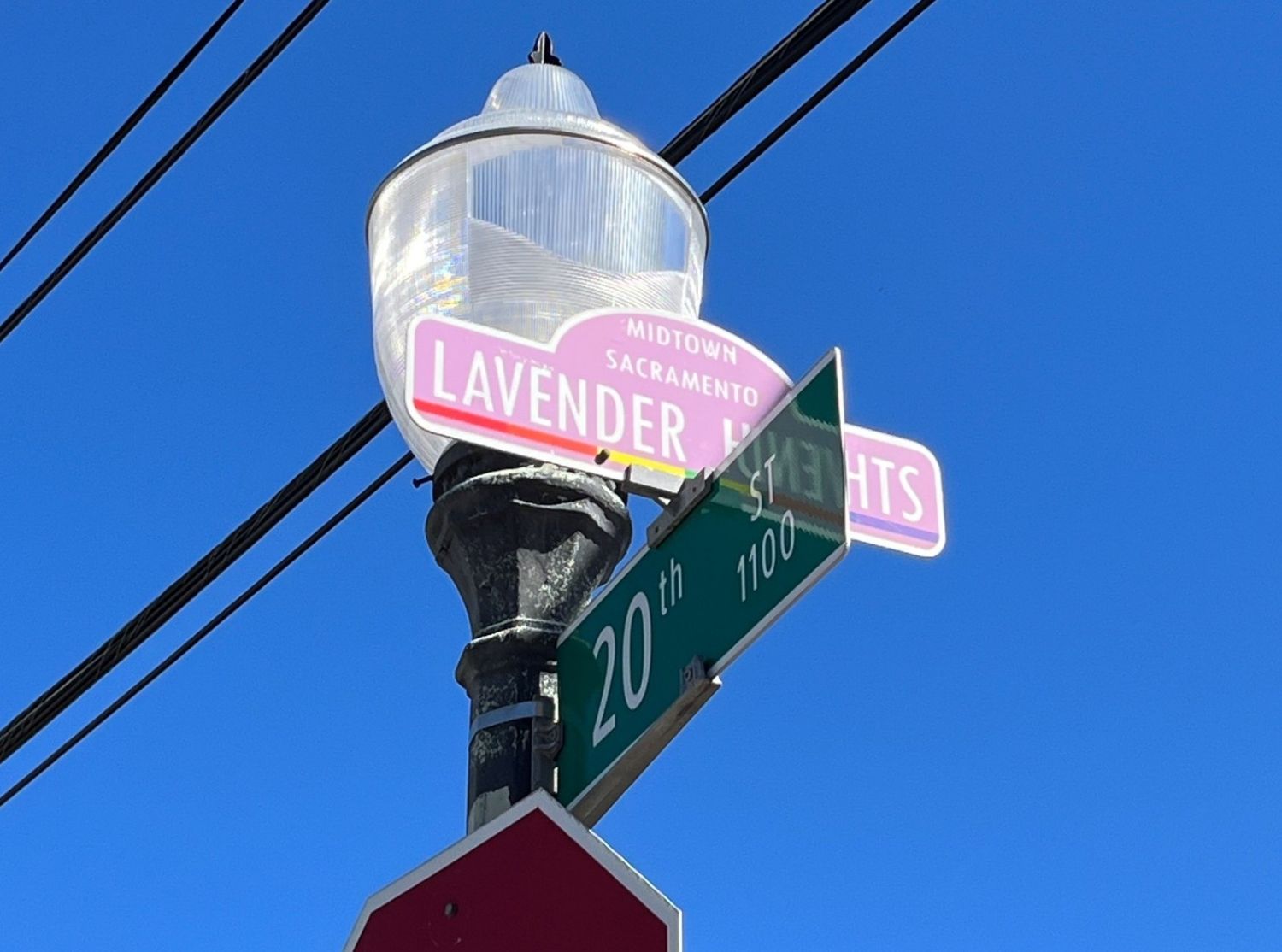 Street light with street signs for Lavender Heights and 20th street. 