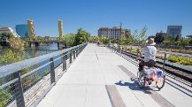 Person biking on riverfront