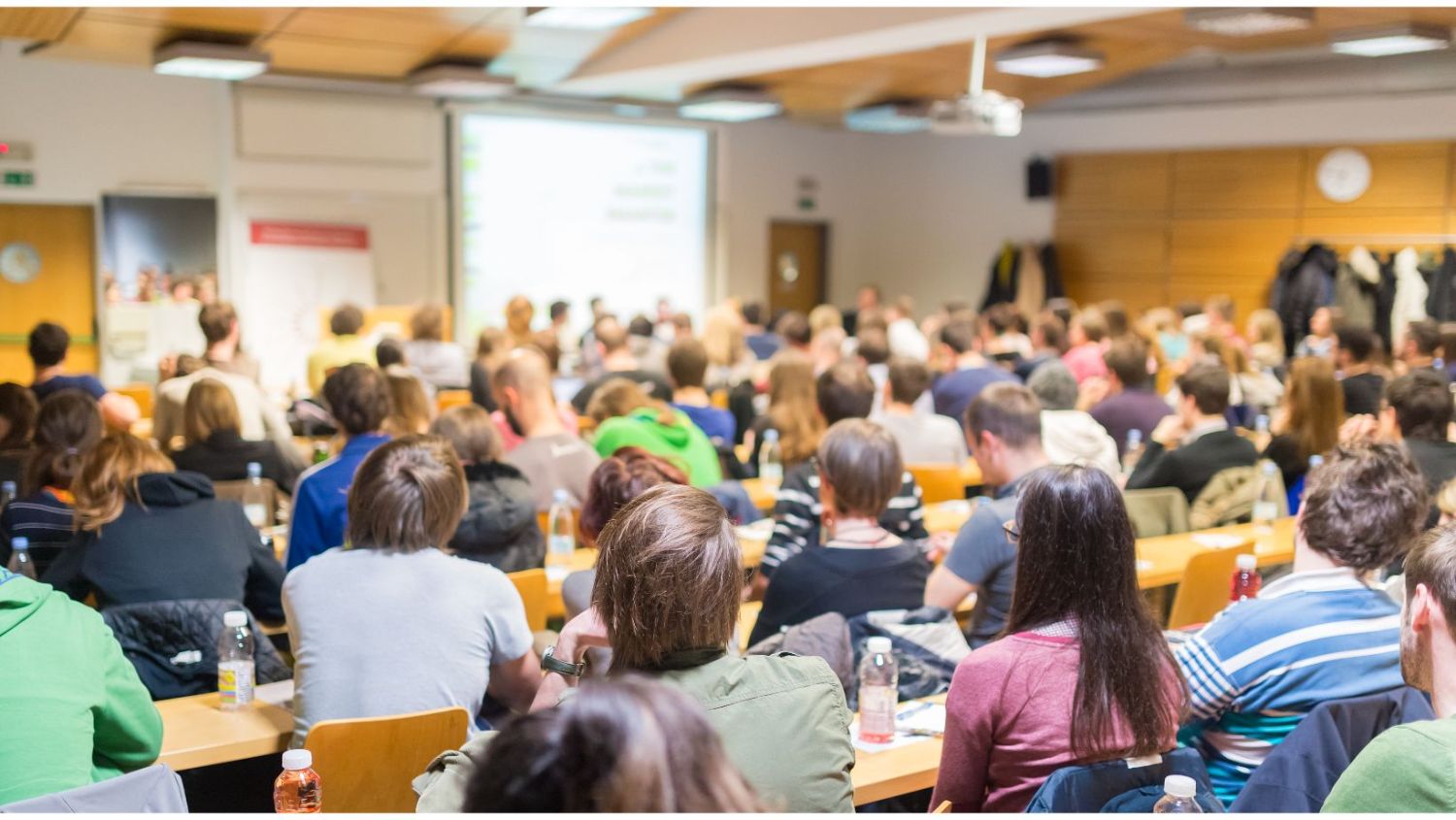 Image of crowded college lecture hall.