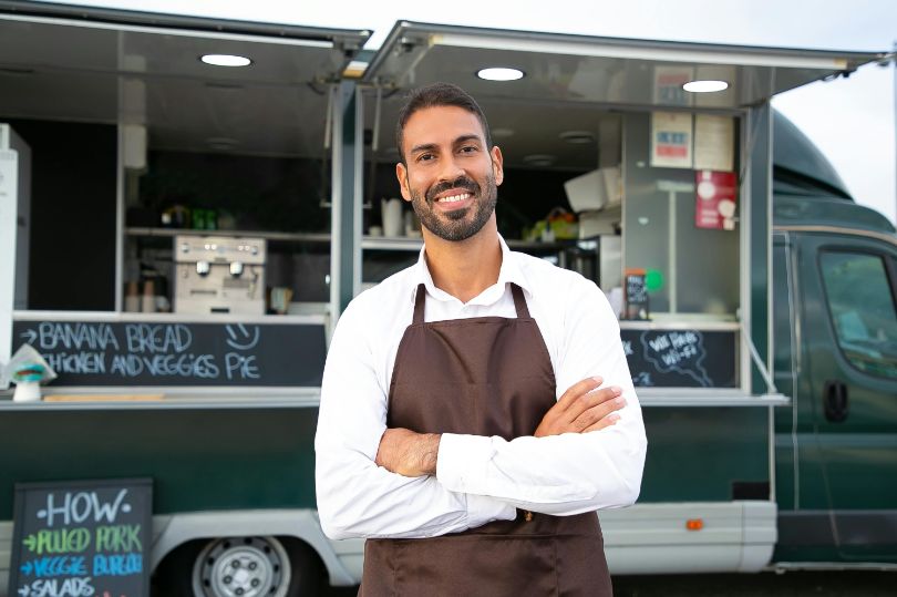 Man standing in front of food truck