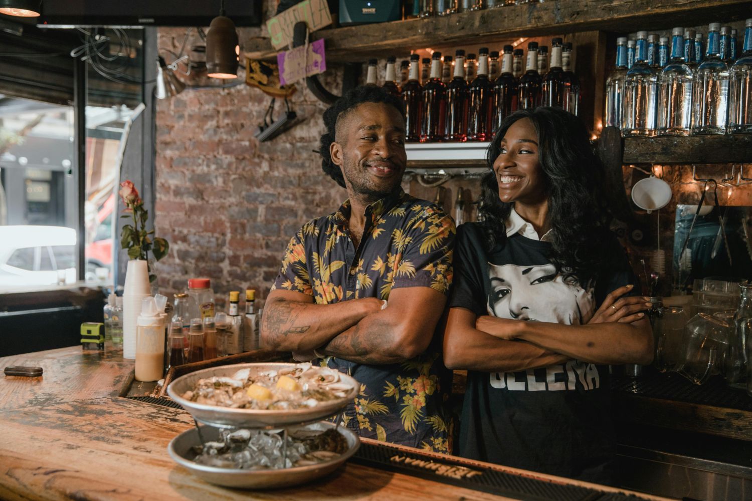 Two business owners standing in their restaurant