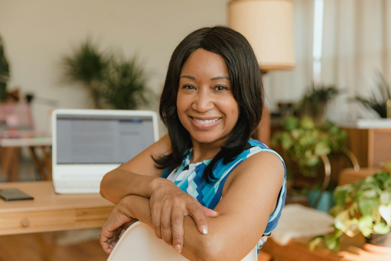 Woman smiling in front of computer