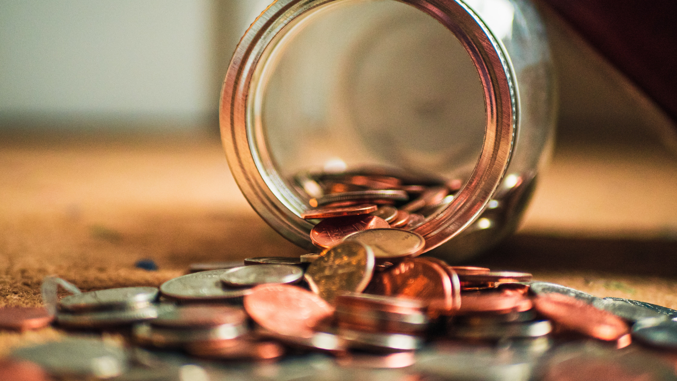 Coins falling out of cup