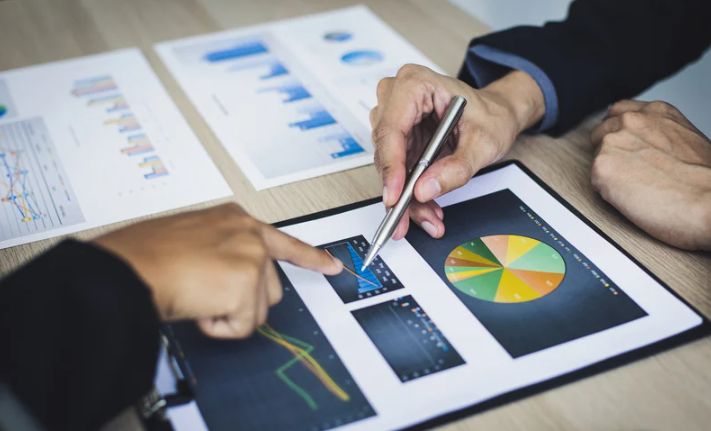People analyzing graphs