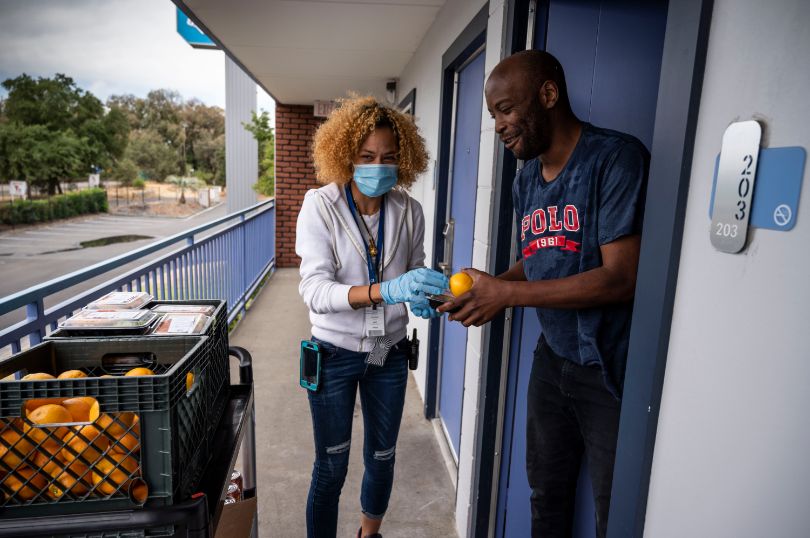 person handing out food