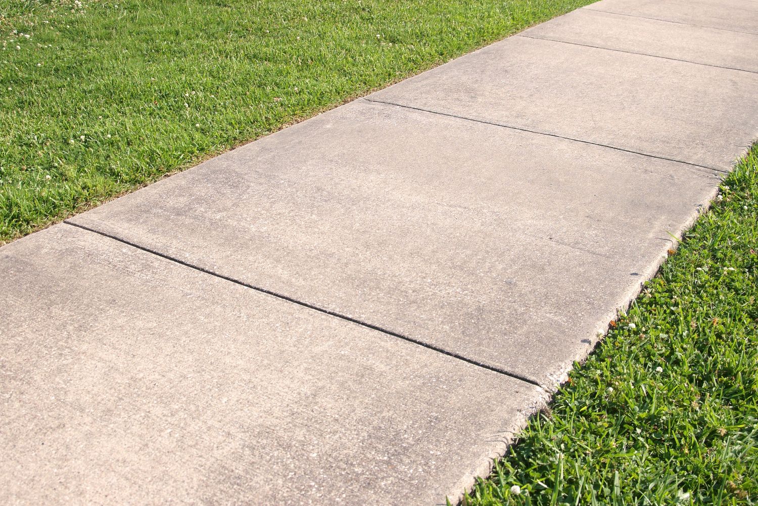 An image of a sidewalk next to grass