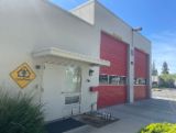 Station 18 white building with red garage doors 
