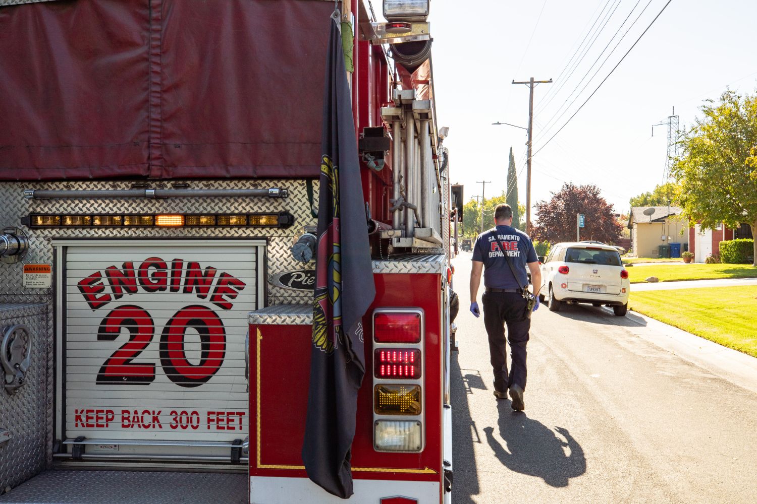 back of engine 20 firefighter walking next to it