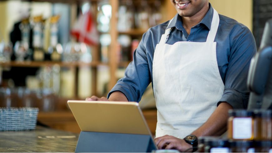 Employee at a small business working on tablet