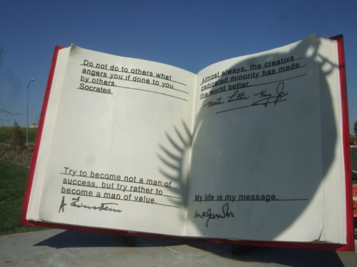 Art installation of a big book. White pages, black text