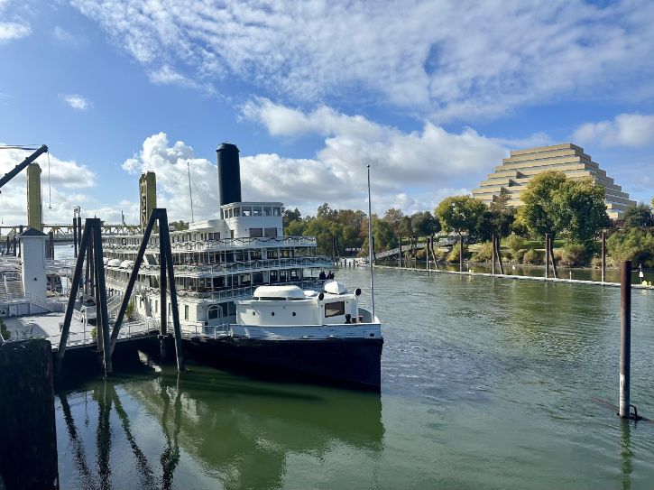 Old Sacramento waterfront, Delta King, river, Tower Bridge, blue sky and clouds