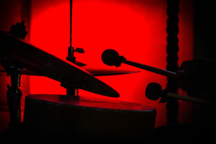 Drum kit silhouette with red light