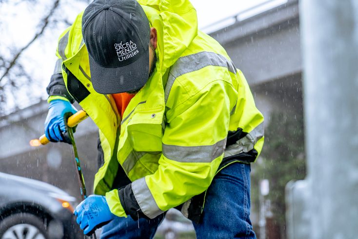 City crew member working during storm