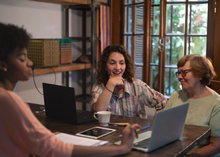 Three women working on laptops