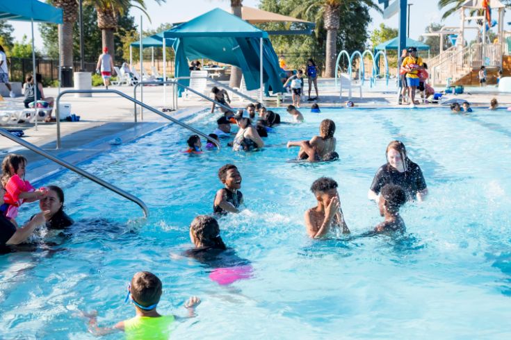 Public pool, people swimming