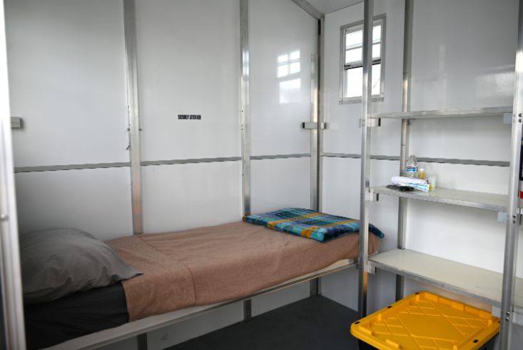 bed inside palette home, blankets
