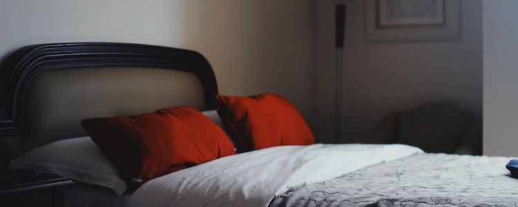 bed with red pillows