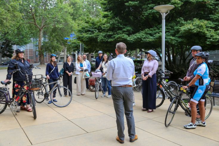 A group of bikers outside of City Hall.