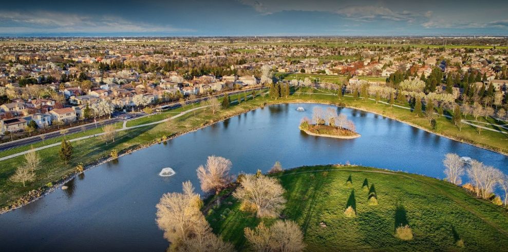 North Natomas Regional Park, grass, trees, houses
