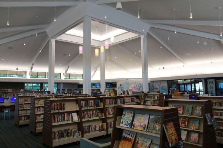 Inside public library, shelves of books