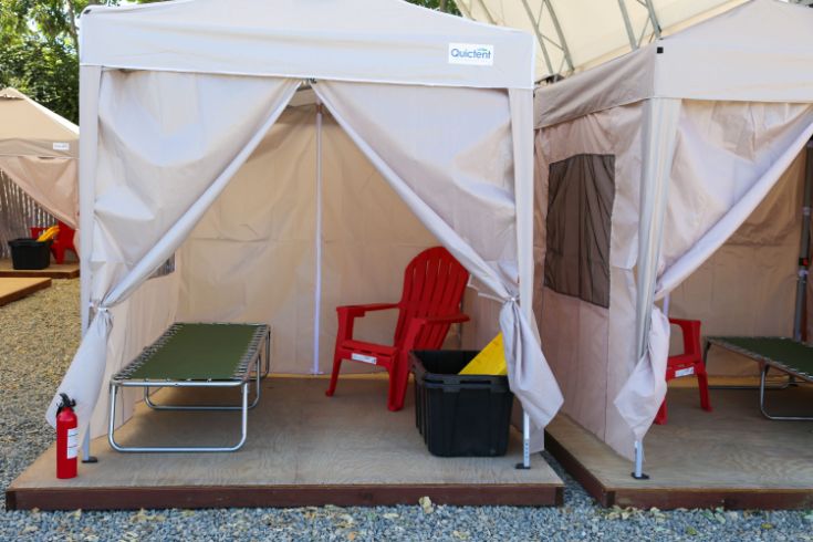 White tent, red chair, storage bin, 