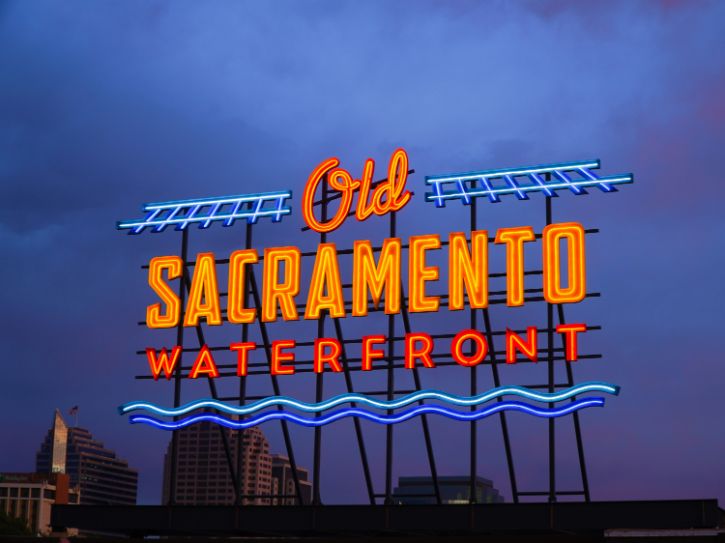Old Sacramento Waterfront neon sign, night sky