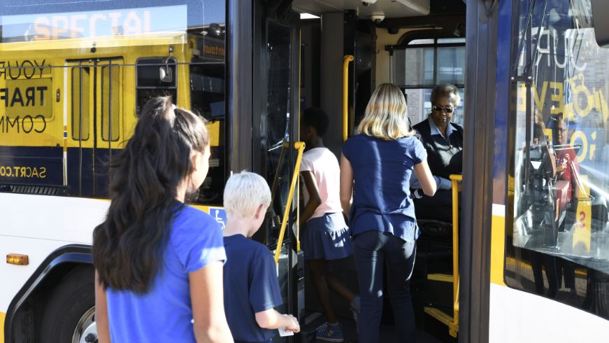 Kids getting onto a SacRT bus