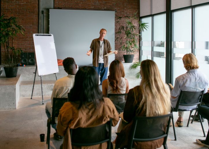 Person speaking to an audience 