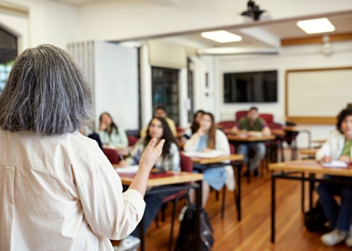 Person talking in front of a classroom