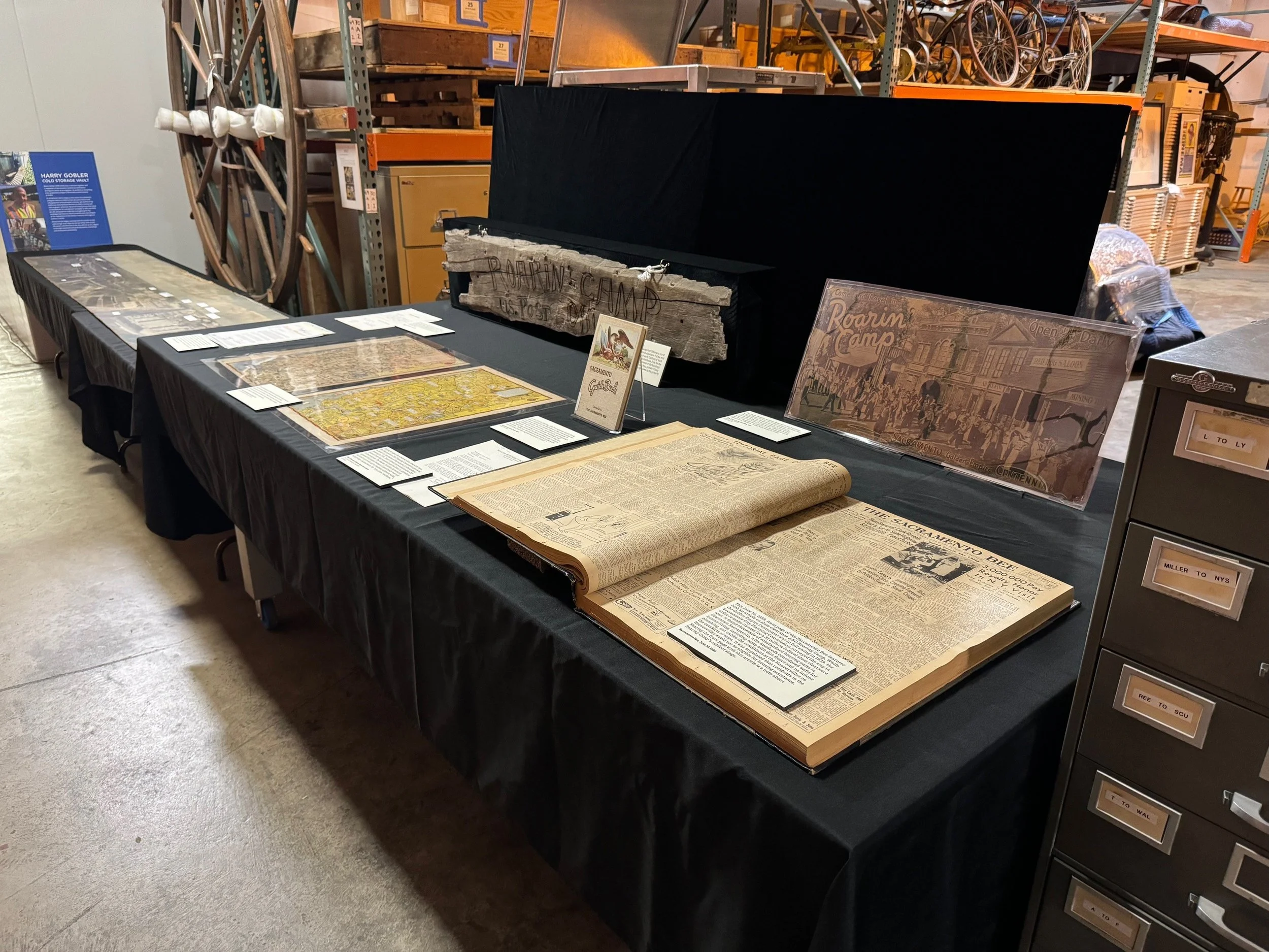 Historic books and photos on table