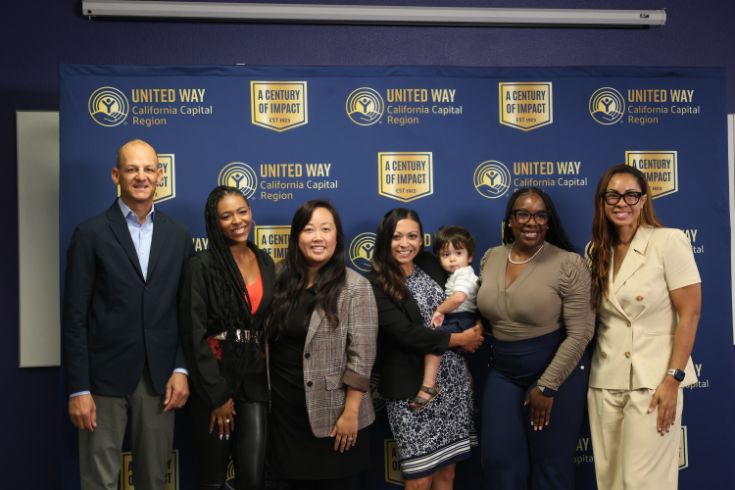 group photo with toddler in center